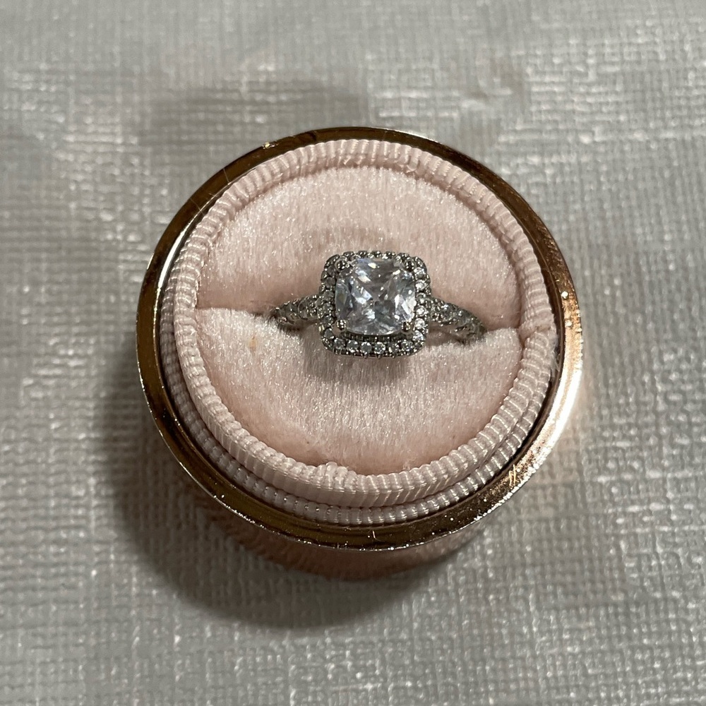 Beautiful, silver in color, ladies, adjustable, fashion ring with cushion stone
